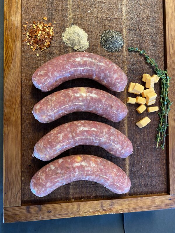 Image of the Variety Fresh Sausage Package featuring 8 individual packages of sausage made from quality meats, sea salt, and spices. The packaging emphasizes the absence of binders, fillers, or nitrates, ensuring clean and tasty sausages. Perfect for both beef and pork lovers, this package offers a variety of options for wholesome and delicious meals.